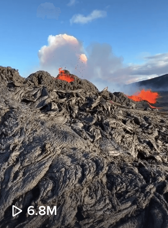 touching newly hardened liquid hot magma volcan eruption video Chris Burkard TikTok travel influencer photographer